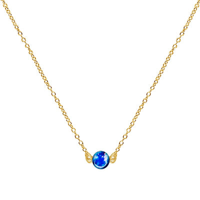 close up of dainty gold necklace for colon cancer awareness with small round blue cell image under resin pendant and adjustable chain